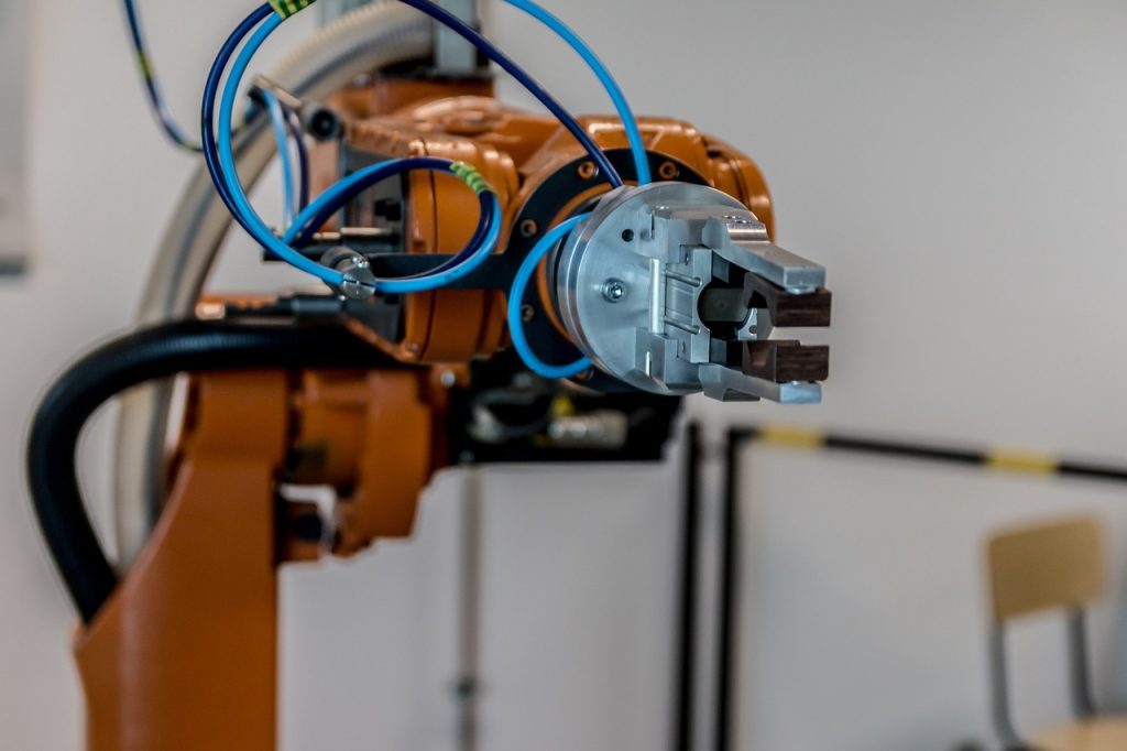 AIによる自動生成の仕組みをイメージした自動化ラインのロボットアーム